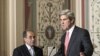 Senate Foreign Relations Committee Chairman Sen. John Kerry (r) with Mahmoud Jibril, representative for foreign affairs with the Libyan Transitional National Council, after their meeting on Capitol Hill in, May 11, 2011