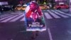 A man exits after watching U.S. President Barack Obama's acceptance speech broadcast live in New York's Times Square following his re-election, November 7, 2012. 
