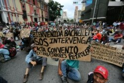 Former workers of Petroleos de Venezuela, PDVSA, shout slogans against Venezuela's President Nicolas Maduro during a protest outside of the Vice President's office, demanding the paid of salaries in Caracas, Venezuela, June 20, 2019.