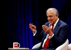 FILE - U.S. envoy for peace in Afghanistan Zalmay Khalilzad speaks during a debate in Kabul, Afghanistan, April 28, 2019.