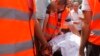A supporter of deposed Egyptian President Mohamed Morsi cries as he looks at the body of a relative being removed by ambulance attendants from a field hospital in Cairo's Nasr City July 27, 2013.