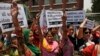 Members of the All India Democratic Women's Association (AIDWA) shout slogans during a protest against the gang rape of two teenage girls, in New Delhi, India, Saturday, May 31, 2014.