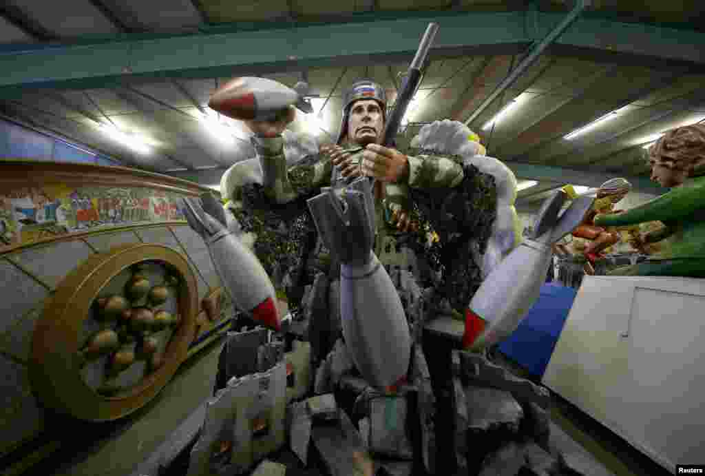 A papier mache caricature figure for a carnival float of Russian President Vladimir Putin is prepared for the upcoming Rose Monday carnival parade in Mainz, Germany.