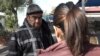 An immigrant gives information to a paralegal at the weekly immigration clinic at a Los Angeles church, one of many legal clinics in the city. (M. O'Sullivan/VOA)