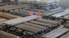 Workers check steel products at a factory in Dalian, Liaoning Province, China, March 30, 2016. 