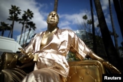 A statue of Harvey Weinstein on a casting couch made by artist Plastic Jesus is seen on Hollywood Boulevard near the Dolby Theatre during preparations for the Oscars in Hollywood, Los Angeles, California, March 1, 2018.
