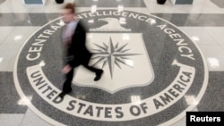 FILE - A man walks through the lobby of CIA headquarters in Langley, Virginia, Aug. 14, 2008. On Wednesday, the agency posted online instructions in Korean, Mandarin and Farsi detailing steps potential informants could safely take to contact U.S. intelligence officials.