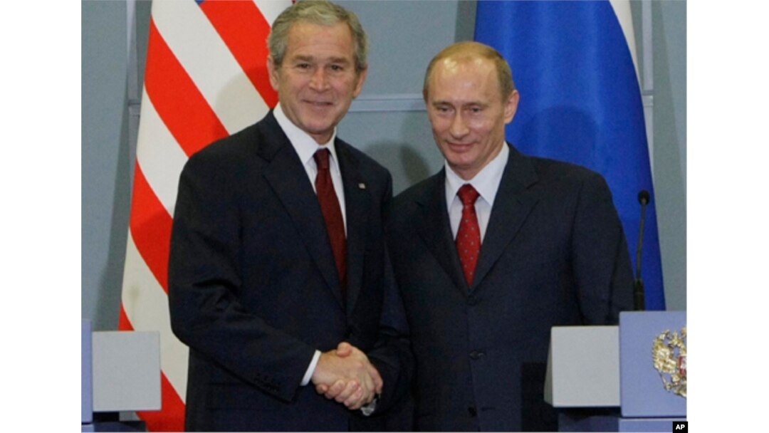 FILE - US President George W. Bush, left, with Russian President Vladimir Putin, right, at the end of their joint and final news conference, Sunday, April 6, 2008 in Sochi, Russia. (AP Photo/Pablo Martinez Monsivais)