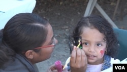 Family members and children enjoyed the festivities of the holiday celebration (M. O'Sullivan/VOA)
