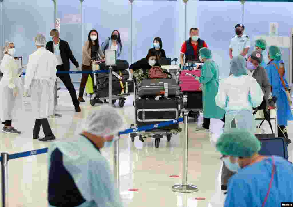 A first group of foreign tourists arrive at Suvarnabhumi Airport during the first day of the country&#39;s reopening campaign - part of the government&#39;s plan to jump start the pandemic-hit tourism sector - in Bangkok, Thailand, Nov. 1, 2021.