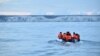 FILE - Migrants travel in a dinghy on the waters of the English Channel toward the south coast of England on Sept. 1, 2020, after crossing from France.