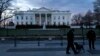 FILE - Secret Service Uniformed Division officers patrol in front of the White House, Washington, D.C., Jan. 20, 2015.