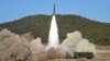 This picture taken on Jan. 14, 2022, and released from North Korea's official Korean Central News Agency on Jan. 15 shows the firing of a railway-borne missile, in Pyongan province. 
