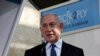 FILE - Israeli Prime Minister Benjamin Netanyahu speaks at Ben-Gurion International Airport, near Tel Aviv, Nov. 9, 2020.
