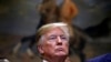 FILE - President Donald Trump attends a ceremony before signing an executive order establishing the White House Opportunity and Revitalization Council, in the Roosevelt Room of the White House.