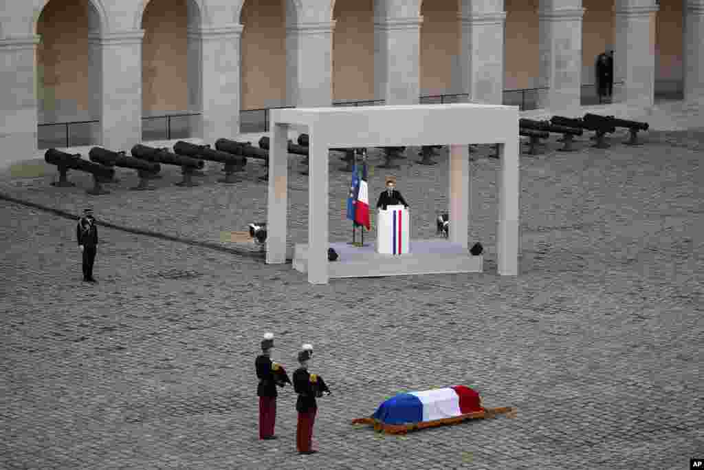 French President Emmanuel Macron delivers his speech to pay his respects to the coffin of WWII fighter and &quot;Compagnon de la Liberation&quot; Daniel Cordier during a ceremony, in the courtyard of the Invalides monument in Paris.