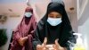 FILE - Somali females wash their hands during coronavirus awareness training conducted by local paramedics and doctors in Mogadishu, March 19, 2020. Classes in the country were shut in March to try to halt the spread of the coronavirus.