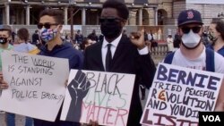 FILE - Protesters demonstrate near the U.S. Embassy in Paris. (Lisa Bryant/VOA)