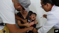 A boy cries as he receives a vaccine against yellow fever at a public health center in Sao Paulo, Brazil, Jan. 16, 2018.