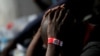 FILE: A migrant intercepted aboard a dinghy off the coast in the Mediterranean Sea, is seen with scabies on his body, after arriving on a rescue at the port of Malaga, southern Spain July 7, 2018.