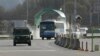South Korean vehicles returning home from North Korea's Kaesong are escorted by a South Korean military vehicle upon their arrival at the customs, immigration and quarantine office near the border village of Panmunjom, April 9, 2013.