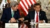 Peru's President Ollanta Humala, right, jokes with U.S. Secretary of State John Kerry — in Lima for a conference on climate change — as they talk to reporters following a private meeting in the Peruvian capital, Dec. 11, 2014.