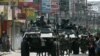 Government soldiers with armored personnel carriers move to reinforce the government forces battling the Moro National Liberation Front (MNLF) rebels near the hostile ground in Zamboanga City, southern Philippines, Sept. 10, 2013. 