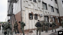 Special Force (OMON) officers in front of Chechen parliament complex after a bomb blast in Grozny, Chechnya, 19 Oct 2010.