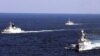 Chinese navy vessels take part in a drill in Zhoushan in east China's Zhejiang province, October 19, 2012.
