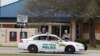 FILE - Military police guard the visitors center at the entrance to Fort Hood, Texas. 