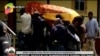 In this image taken from OBN video, the coffin of Ethiopia singer Hachalu Hundessa is carried during his funeral in Ambo, Ethiopia, July 2, 2020. 