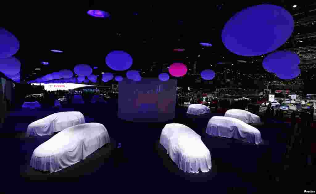 Cars are covered at the stand of Renault at the 86th International Motor Show in Geneva, Switzerland.
