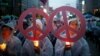People attend a candlelight vigil wishing for a successful summit between the U.S. and North Korea, in front of the U.S. embassy in central Seoul, South Korea, June 9, 2018.