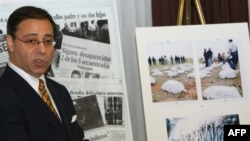 FILE - U.S. lawyer Jonathan Reiter addresses a press conference next to newspaper clippings and photos displaying stories of alleged torture and killing by Colombian paramilitaries on the payroll of banana giant Chiquita Brands International in New York, Nov. 14, 2007.