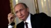 Russia's President Vladimir Putin attends a news conference in Vienna on June 24, 2014.