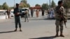 Security forces guard near Abdul Jabar Qahraman's house, a parliamentary election candidate, after he was killed in an explosion inside his home in Lashkar Gah, Afghanistan, Wednesday, Oct. 17, 2018.