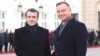 President Emmanuel Macron,left, of France and his Polish host, President Andrzej Duda, shake hands before talks on developing recently-strained bilateral ties at the Presidential Palace in Warsaw, Poland, Feb. 3, 2020.