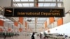 FILE - A worker walks at the departure area of the Islamabad International Airport, during a media tour.