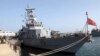 This photo released by the US Navy on March 13, 2003, shows the US Navy patrol boat USS Firebolt moored in port displaying the "Don't Tread On Me" flag, March 10, 2003, at Camp Patriot, Kuwait.
