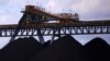Coal is unloaded onto large piles at the Ulan Coal mines near the central New South Wales town of Mudgee in Australia, March 8, 2018. 