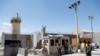 Afghan soldiers stand guard at the gate of Bagram Airfield, on the day the last of the American troops vacated it, Parwan province, Afghanistan, July 2, 2021.