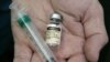 A doctor holds a vial of the human papillomavirus (HPV) vaccine Gardasil in his Chicago office. 