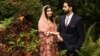 Nobel Peace Prize laureate Malala Yousafzai stands next to husband Asser in a picture published with a social media post in which she announced her marriage, in Birmingham, Britain, November 9, 2021 in this image from social media. Picture taken November 9, 2021. Malin Fezehai - 
