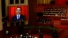 China&#39;s Premier Li Keqiang is seen on a screen delivering the government work report during the opening ceremony of the National People&#39;s Congress (NPC) at the Great Hall of the People in Beijing, March 5, 2014.
