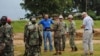 U.S. soldiers and their Liberian counterparts survey a construction site for an Ebola virus treatment center outside Monrovia on Oct. 3, 2014.