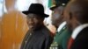  Nigerian President Goodluck Jonathan (L) arrives to attend the closing session of the ECOWAS summit in Abuja, Nigeria, July 18, 2013.