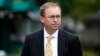 FILE - Mick Mulvaney departs after a television interview at the White House, Sept. 13, 2017, in Washington.