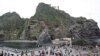 South Korean tourists are on a tour of Seodo, part of the disputed Dokdo islets, in the East Sea, August 1, 2011