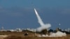 An Iron Dome launcher fires an interceptor rocket in the southern Israeli city of Ashdod, Israel, July 9, 2014. 