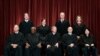 In April 23, 2021, photo, Supreme Court members pose for a group photo. Seated from left: Samuel Alito, Clarence Thomas, John Roberts, Stephen Breyer and Sonia Sotomayor. Standing from left: Brett Kavanaugh, Elena Kagan, Neil Gorsuch, Amy Coney Barrett.
